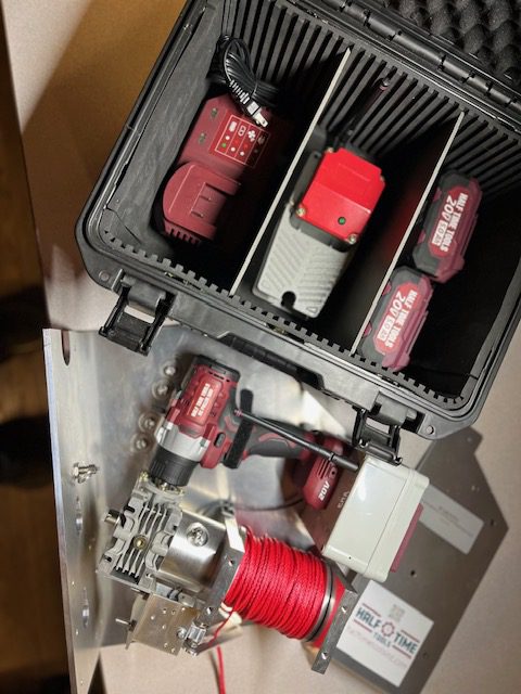 Tool case with drill, red batteries, winch